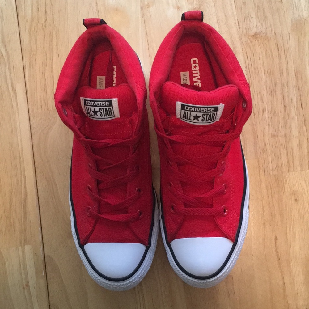 Red Ladies Chuck Taylor Converse boots.